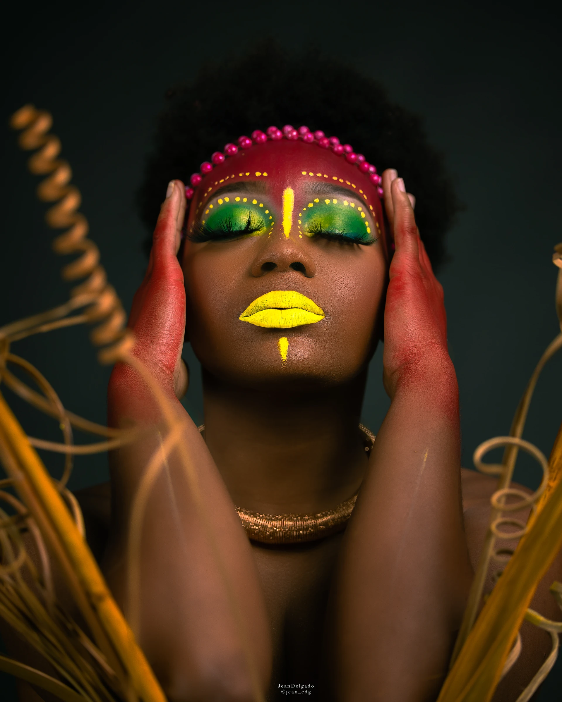 Color editorial portrait with yellow and green face paint