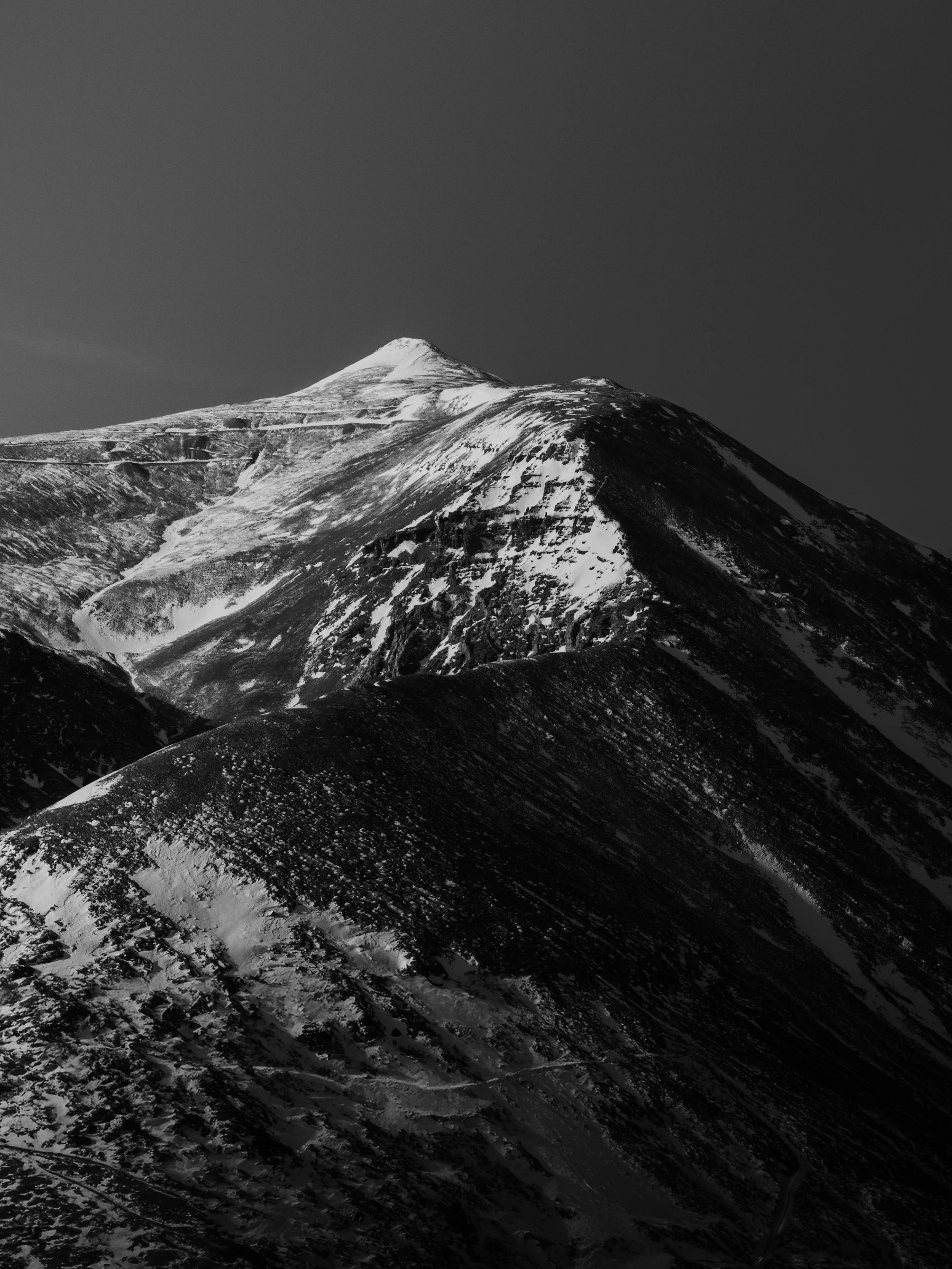 Snow-covered Colorado mountain in black and white
